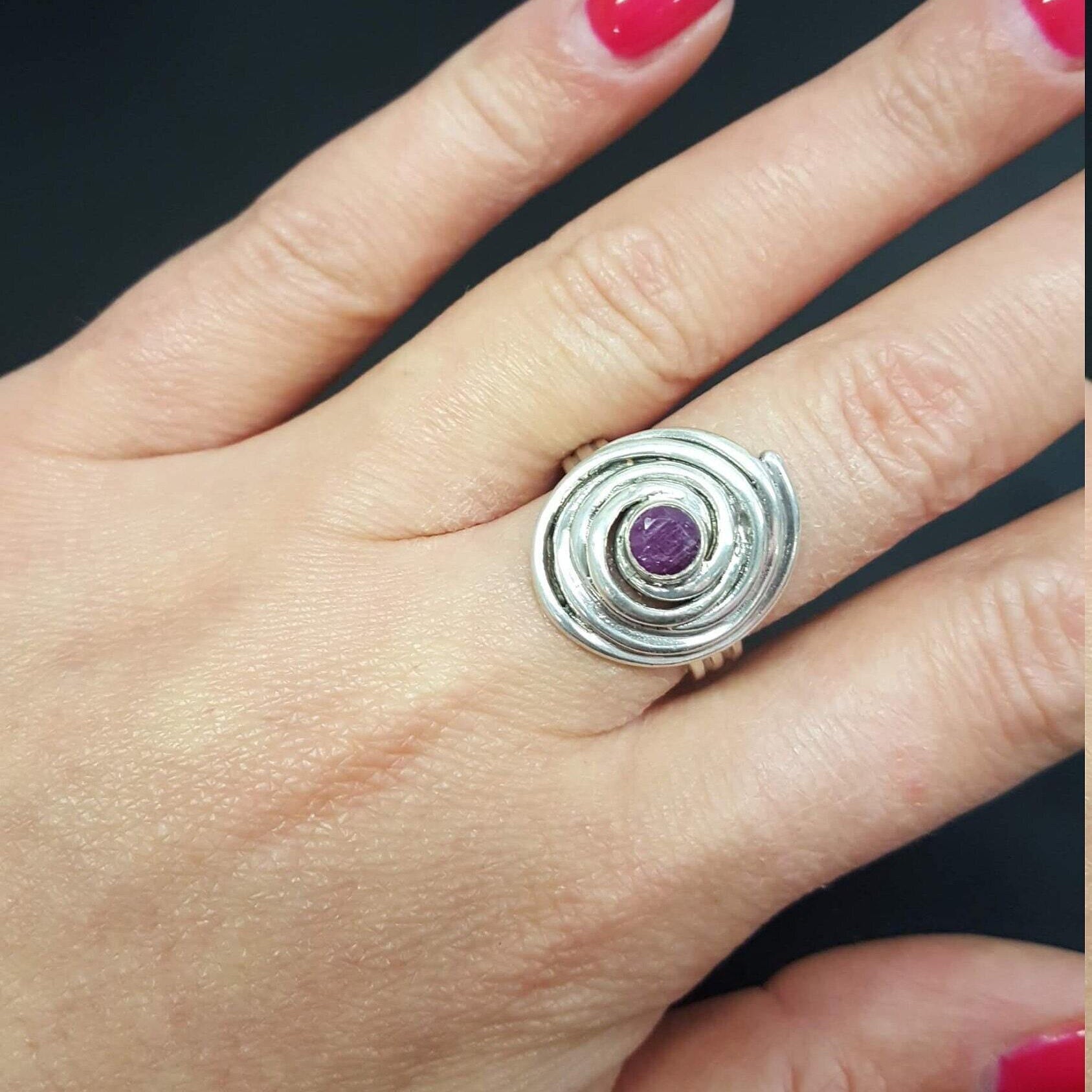 Elegant 925 Sterling Silver ring featuring a round natural red ruby, perfect for July birthdays and special occasions.