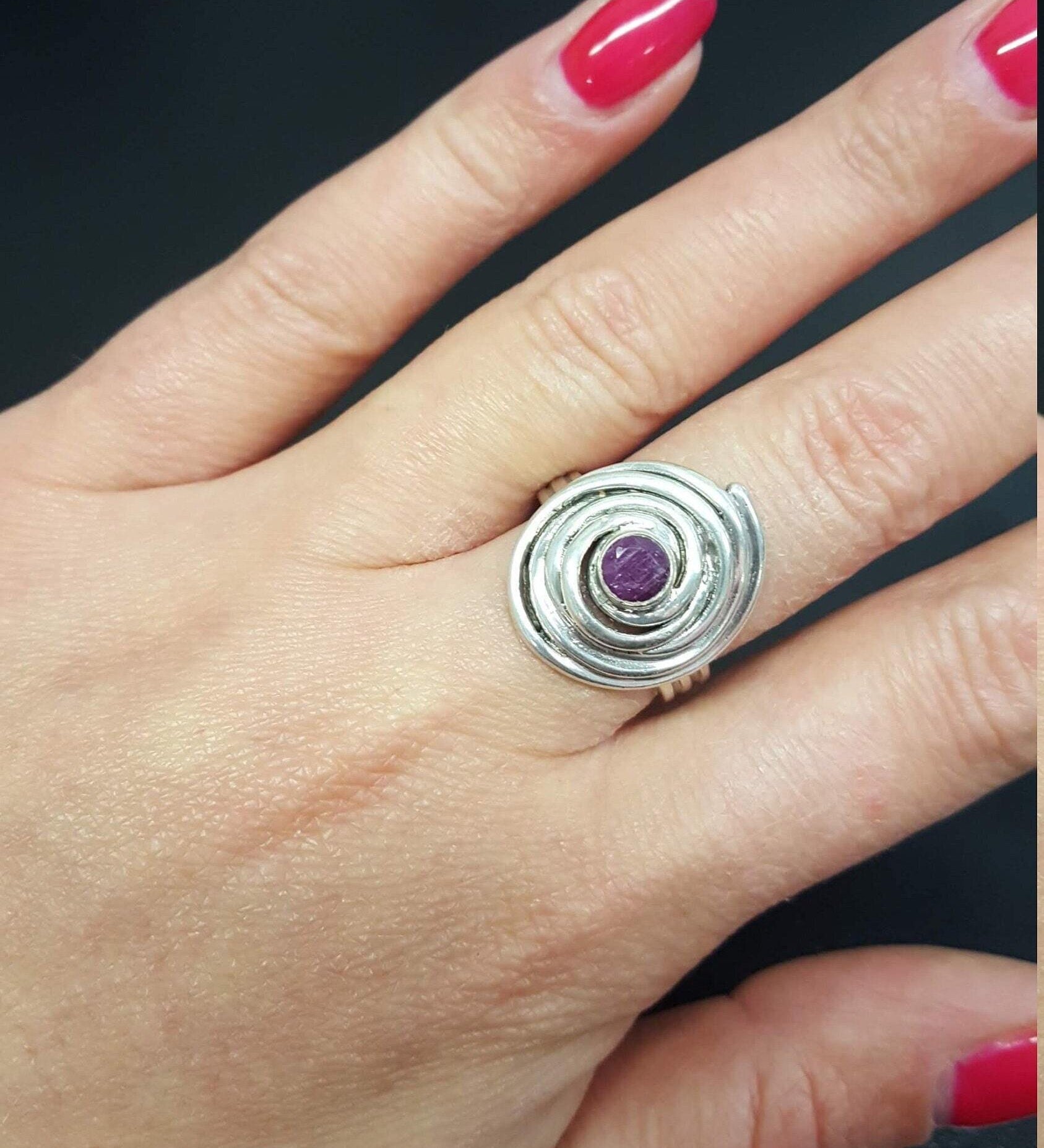 Elegant 925 Sterling Silver ring featuring a round natural red ruby, perfect for July birthdays and special occasions.