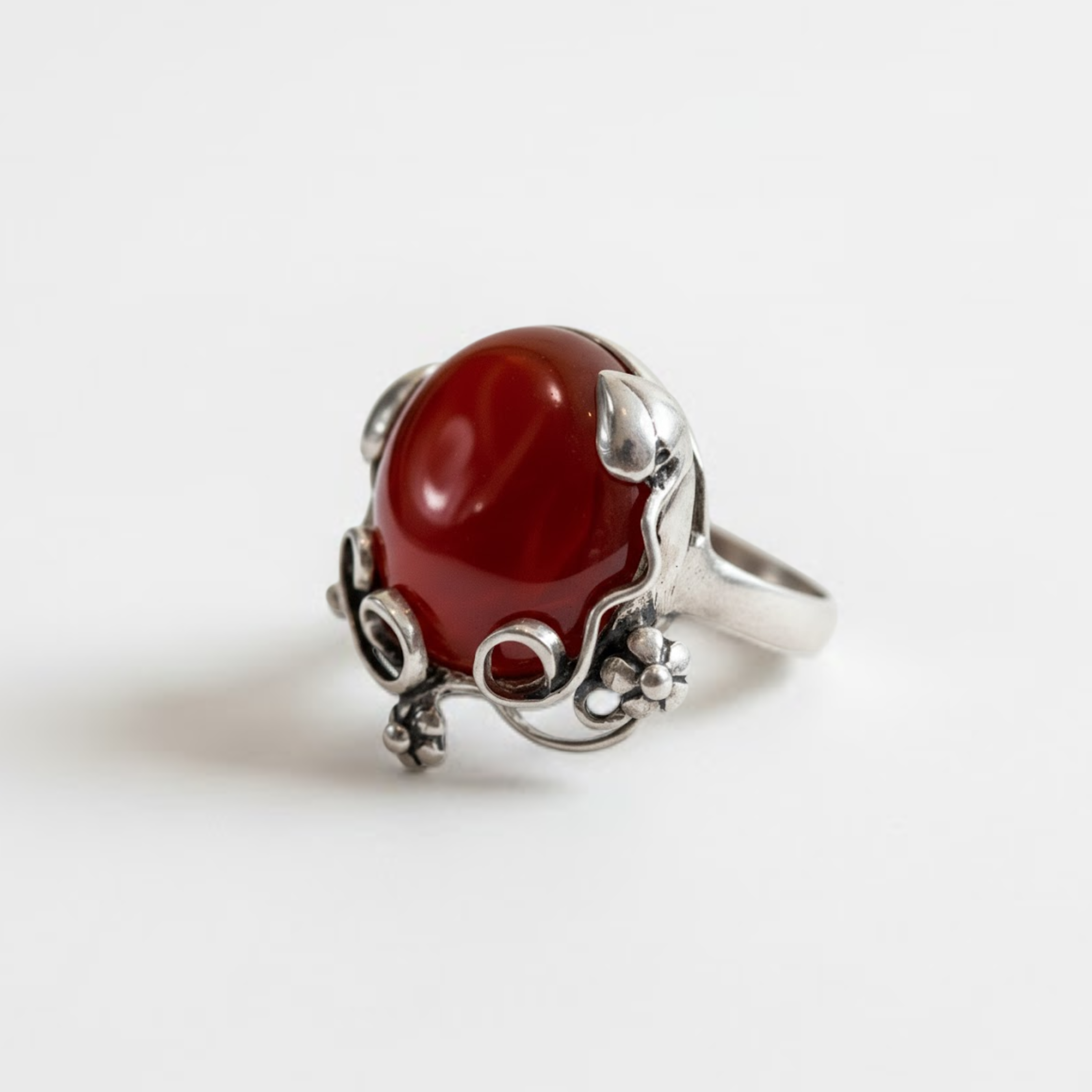 A girl joyfully bouncing on a trampoline in a sunny park, surrounded by trees and blooming flowers.