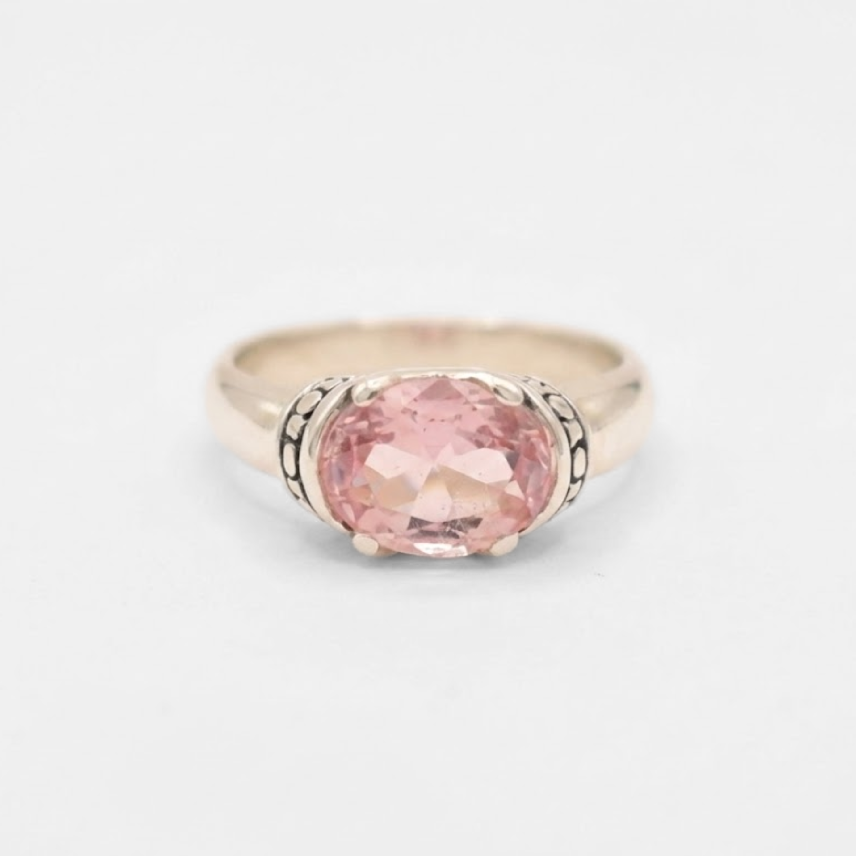 A close-up view of a vibrant sunset over a peaceful lake, reflecting warm colors in the water.