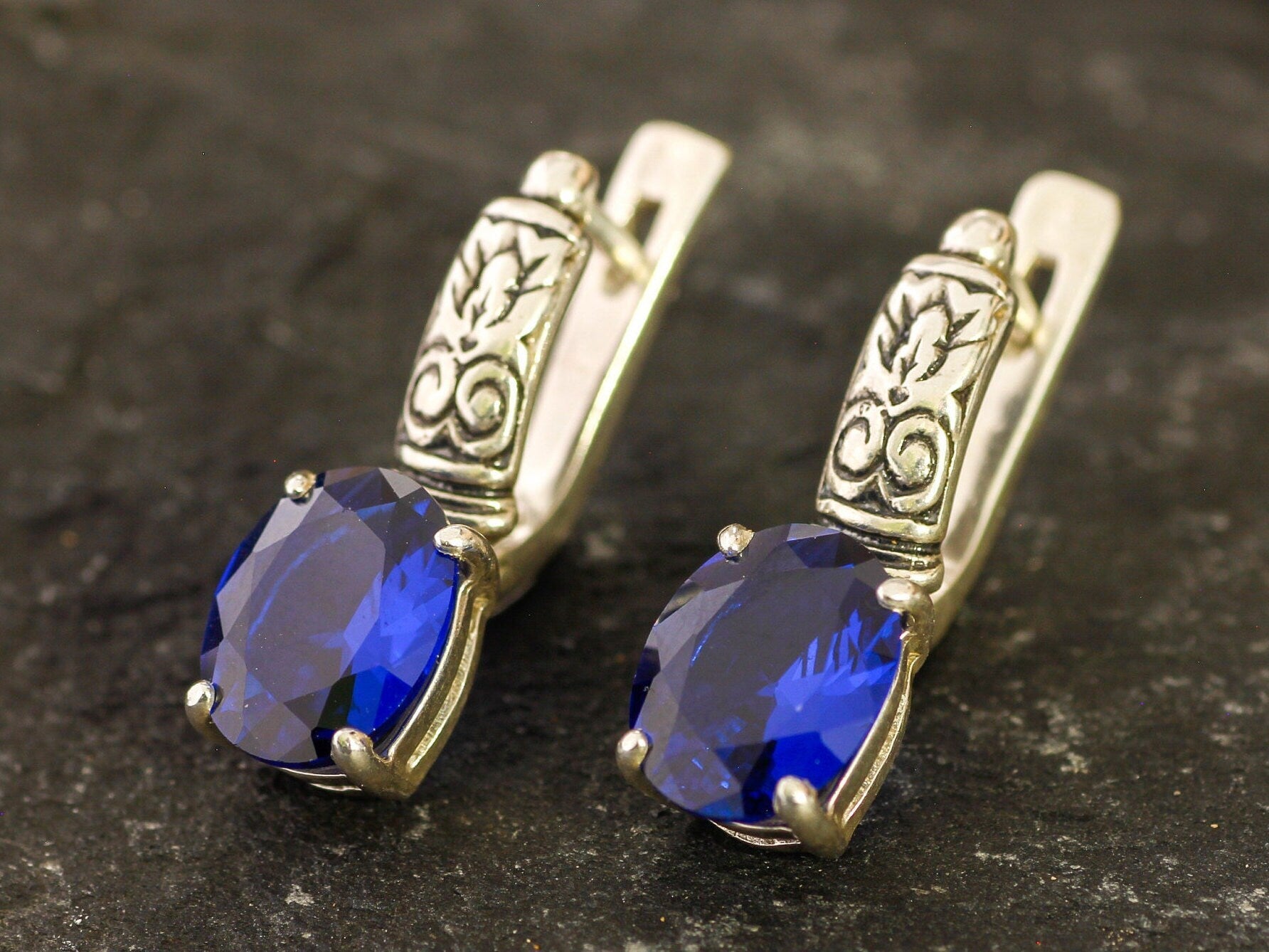 Created Sapphire Earrings made in 925 Sterling Silver with Oval Created Blue Sapphire in Prong setting, September Birthstone gift idea, symbolizes sincerity, truth, and faithfulness, ideal for everyday wear and perfect for birthday gifting and special occasions.