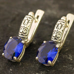 Created Sapphire Earrings made in 925 Sterling Silver with Oval Created Blue Sapphire in Prong setting, September Birthstone gift idea, symbolizes sincerity, truth, and faithfulness, ideal for everyday wear and perfect for birthday gifting and special occasions.