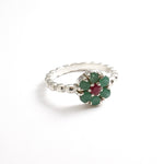 Stylish 925 Sterling Silver ring showcasing a stunning round emerald, a beautiful symbol of growth and emotional healing.