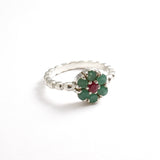 Stylish 925 Sterling Silver ring showcasing a stunning round emerald, a beautiful symbol of growth and emotional healing.