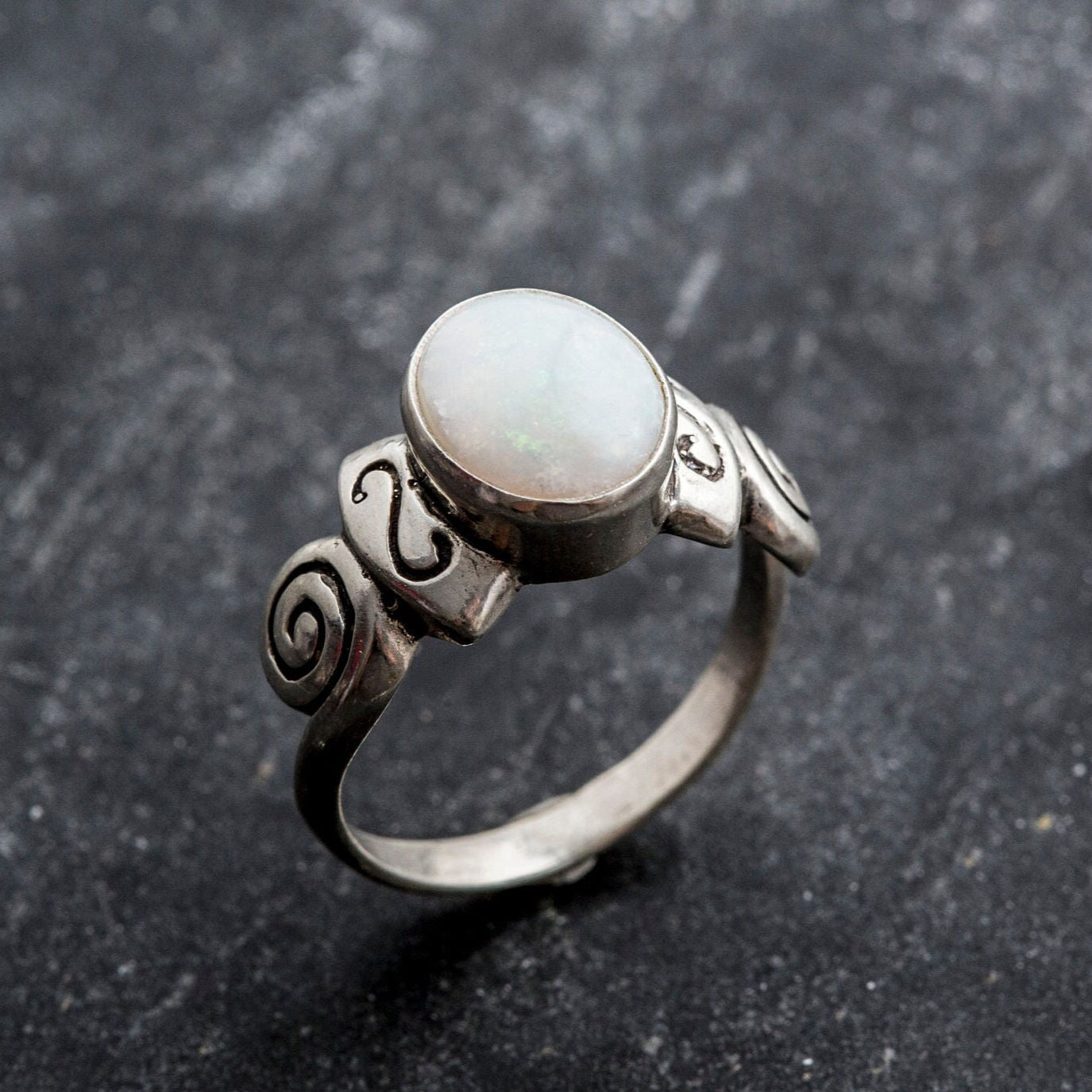 Delicate 925 Sterling Silver ring featuring an Oval Natural White Australian Opal, a beautiful symbol of truth and purity.
