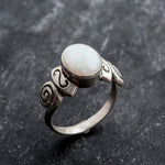 Delicate 925 Sterling Silver ring featuring an Oval Natural White Australian Opal, a beautiful symbol of truth and purity.