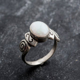 Delicate 925 Sterling Silver ring featuring an Oval Natural White Australian Opal, a beautiful symbol of truth and purity.