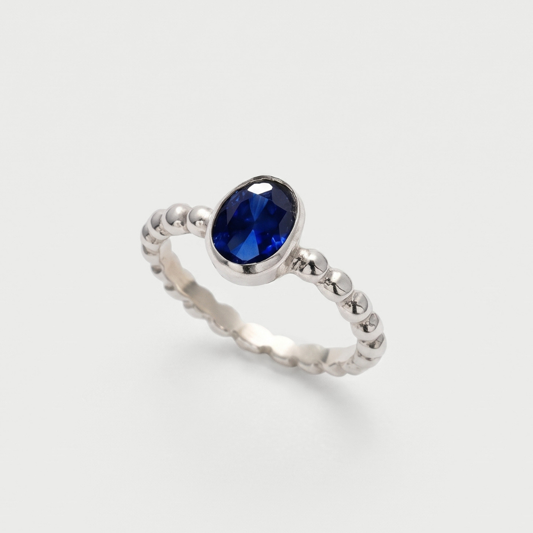 Created Sapphire Ring made in 925 Sterling Silver with Baguette Created Blue Sapphire in Bezel setting, September Birthstone gift idea, symbolizes sincerity, truth, and faithfulness, ideal for everyday wear and perfect for birthday gifting and special occasions.