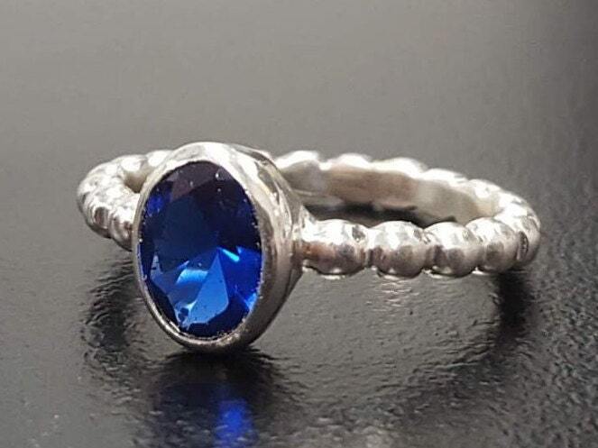 Created Sapphire Ring made in 925 Sterling Silver with Baguette Created Blue Sapphire in Bezel setting, September Birthstone gift idea, symbolizes sincerity, truth, and faithfulness, ideal for everyday wear and perfect for birthday gifting and special occasions.