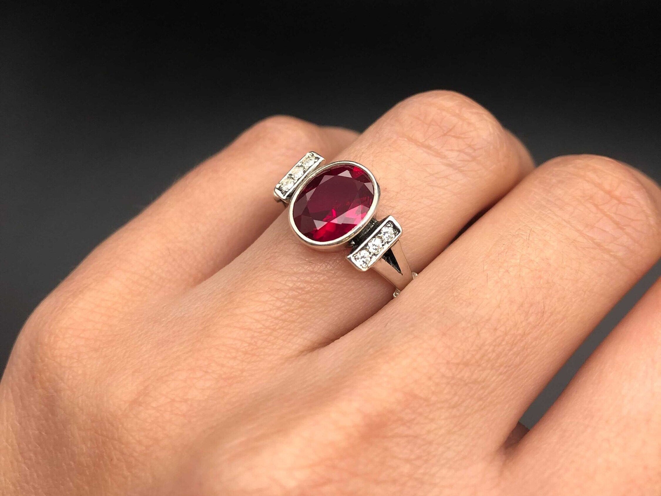 Created Ruby Ring made in 925 Sterling Silver with Oval Created Red Ruby in Bezel setting, July Birthstone gift idea, symbolizes nobility, purity, and passion, ideal for everyday wear and perfect for birthday gifting and special occasions.