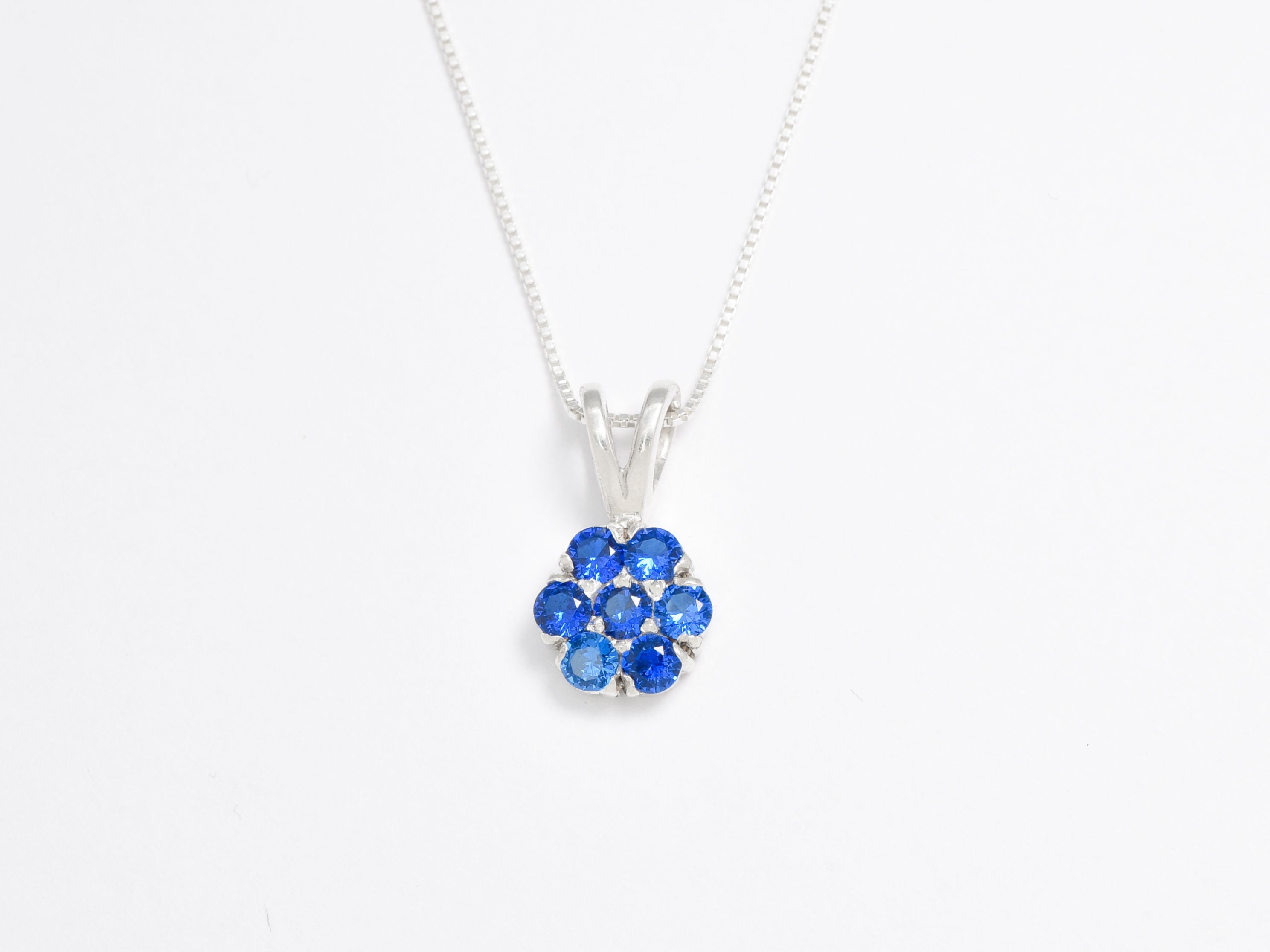 Created Sapphire Pendant made in 925 Sterling Silver with Round Created Blue Sapphire in Cluster setting, September Birthstone gift idea, symbolizes sincerity, truth, and faithfulness, ideal for everyday wear and perfect for birthday gifting and special occasions.