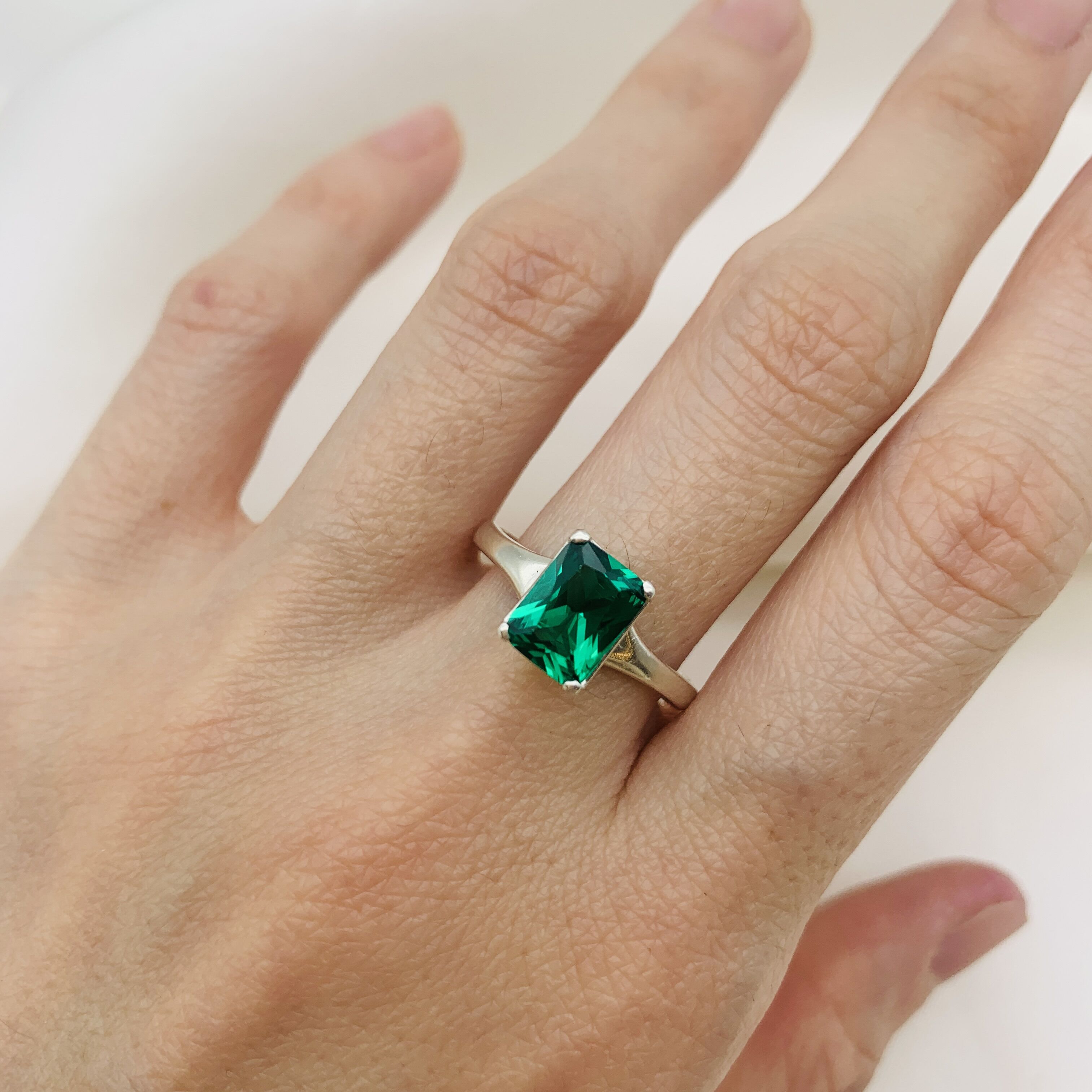 Emerald Ring in 925 Sterling Silver, featuring a green emerald in a classic solitaire setting, perfect for May birthdays.
