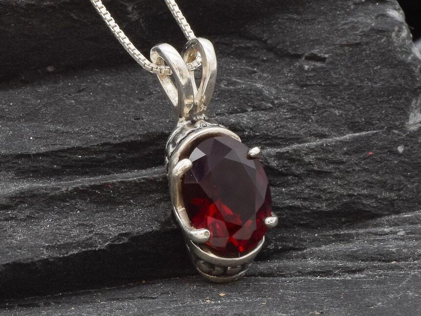 Beautiful Ruby Pendant in 925 Sterling Silver with an Oval Created Red Ruby, a meaningful gift for loved ones celebrating July birthdays.
