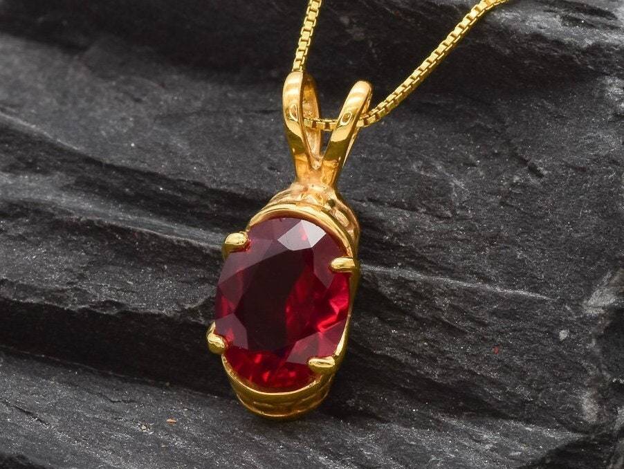 Designed Ruby Pendant in 18k Gold Vermeil featuring an Oval Created Red Ruby, perfect for July birthdays and special occasions.
