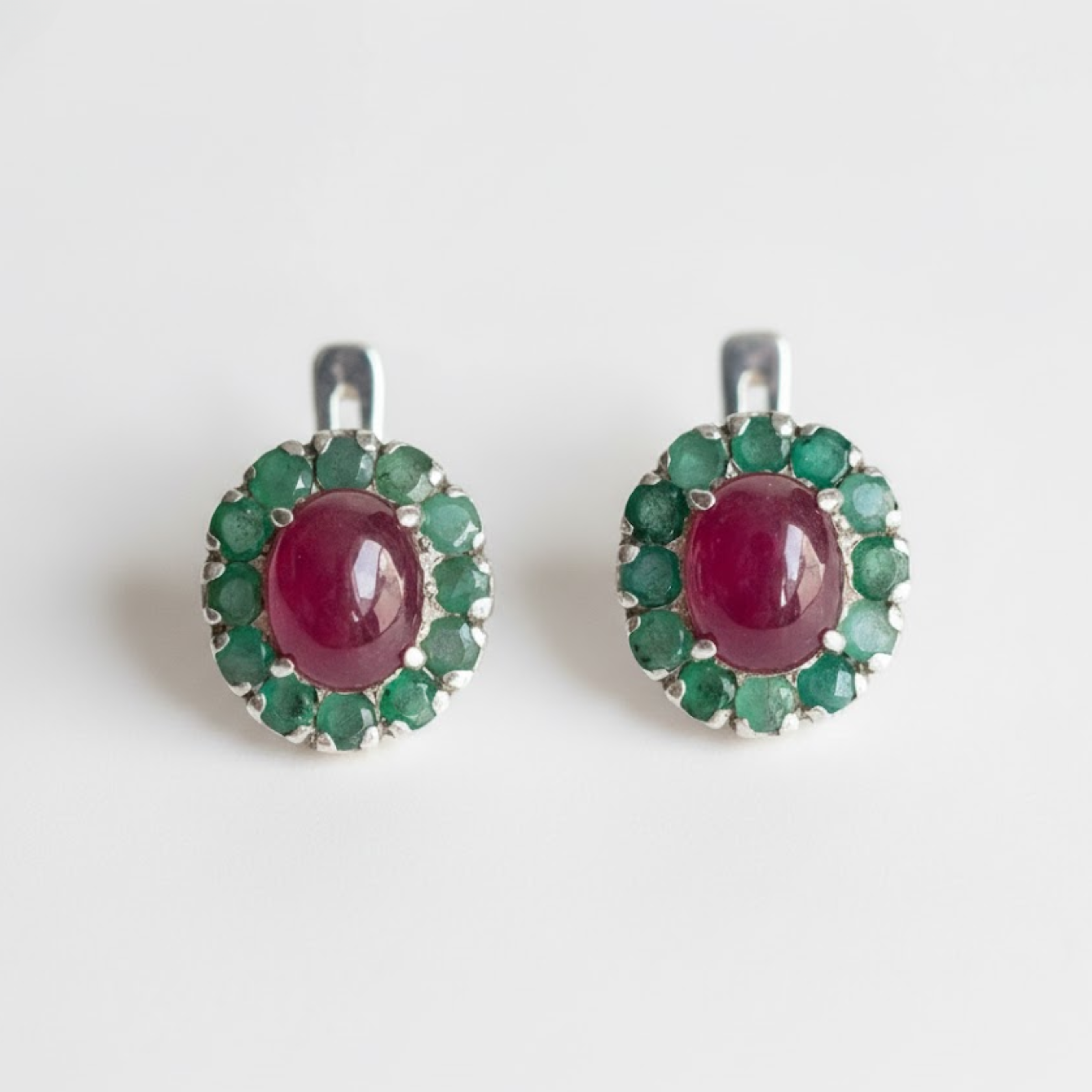 Natural Ruby Earrings made in 925 Sterling Silver with Oval Natural Red Ruby in Halo setting, July Birthstone gift idea, symbolizes nobility, purity, and passion, ideal for everyday wear and perfect for birthday gifting and special occasions.