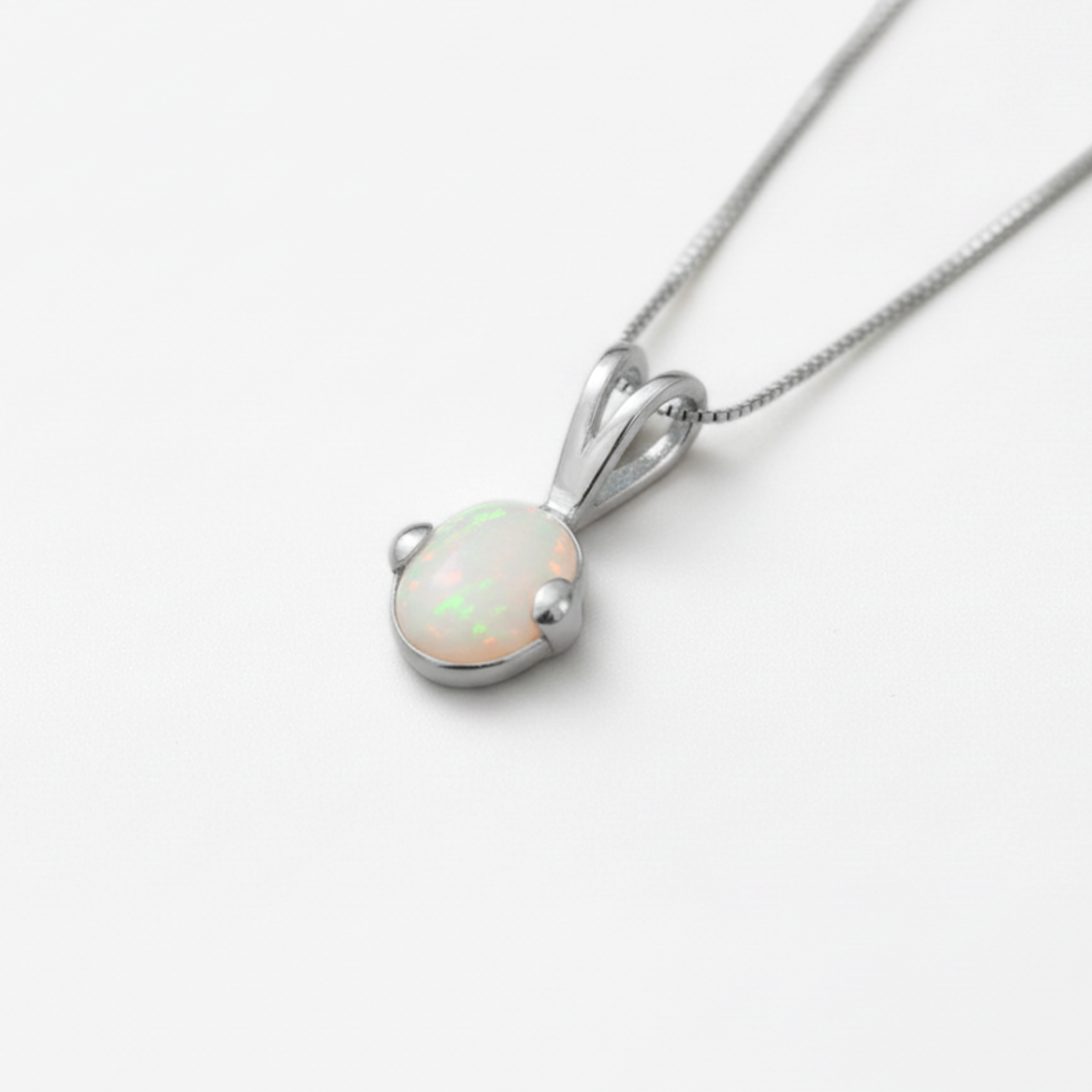 Stylish 925 Sterling Silver Opal Pendant featuring genuine Australian Opal, ideal birthday gift, symbolizes purity and truth.