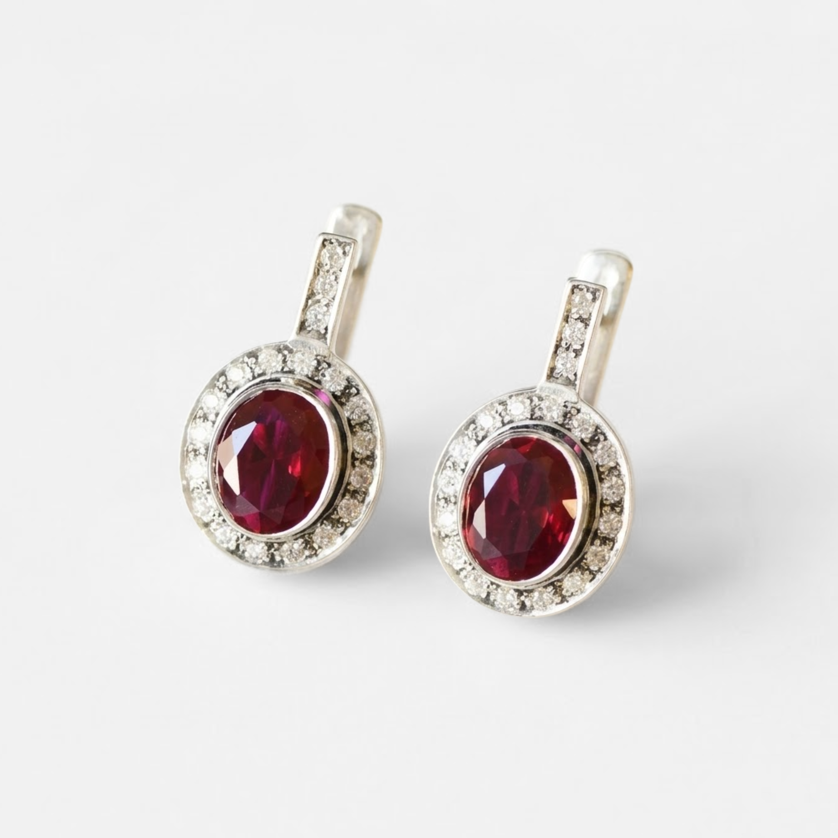 Created Ruby Earrings made in 925 Sterling Silver with Oval Created Red Ruby in Bezel setting, July Birthstone gift idea, symbolizes nobility, purity, and passion, ideal for everyday wear and perfect for birthday gifting and special occasions.