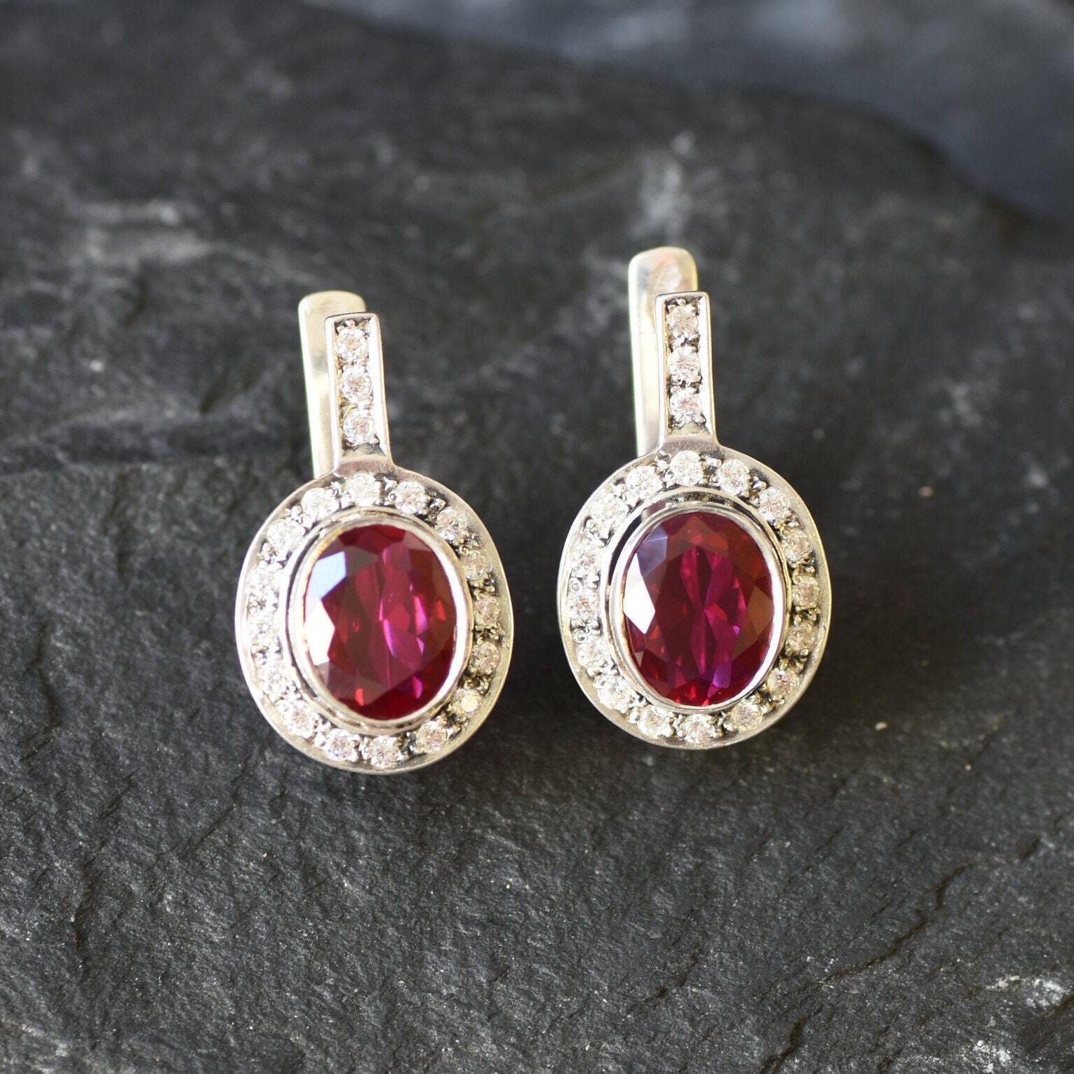 Beautiful Ruby Earrings in 925 Sterling Silver, featuring a vibrant Oval Red Ruby, perfect for special occasions and daily elegance.