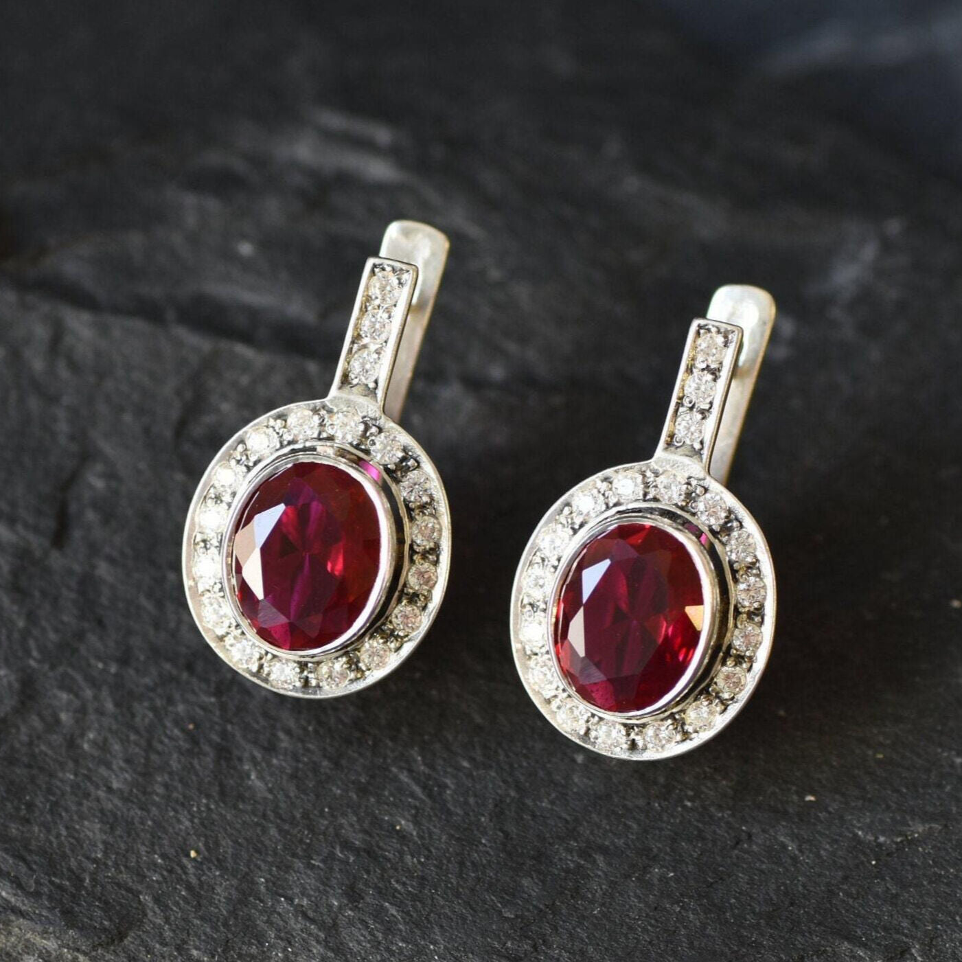 Created Ruby Earrings made in 925 Sterling Silver with Oval Created Red Ruby in Bezel setting, July Birthstone gift idea, symbolizes nobility, purity, and passion, ideal for everyday wear and perfect for birthday gifting and special occasions.