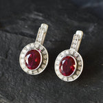 Created Ruby Earrings made in 925 Sterling Silver with Oval Created Red Ruby in Bezel setting, July Birthstone gift idea, symbolizes nobility, purity, and passion, ideal for everyday wear and perfect for birthday gifting and special occasions.