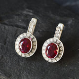Created Ruby Earrings made in 925 Sterling Silver with Oval Created Red Ruby in Bezel setting, July Birthstone gift idea, symbolizes nobility, purity, and passion, ideal for everyday wear and perfect for birthday gifting and special occasions.
