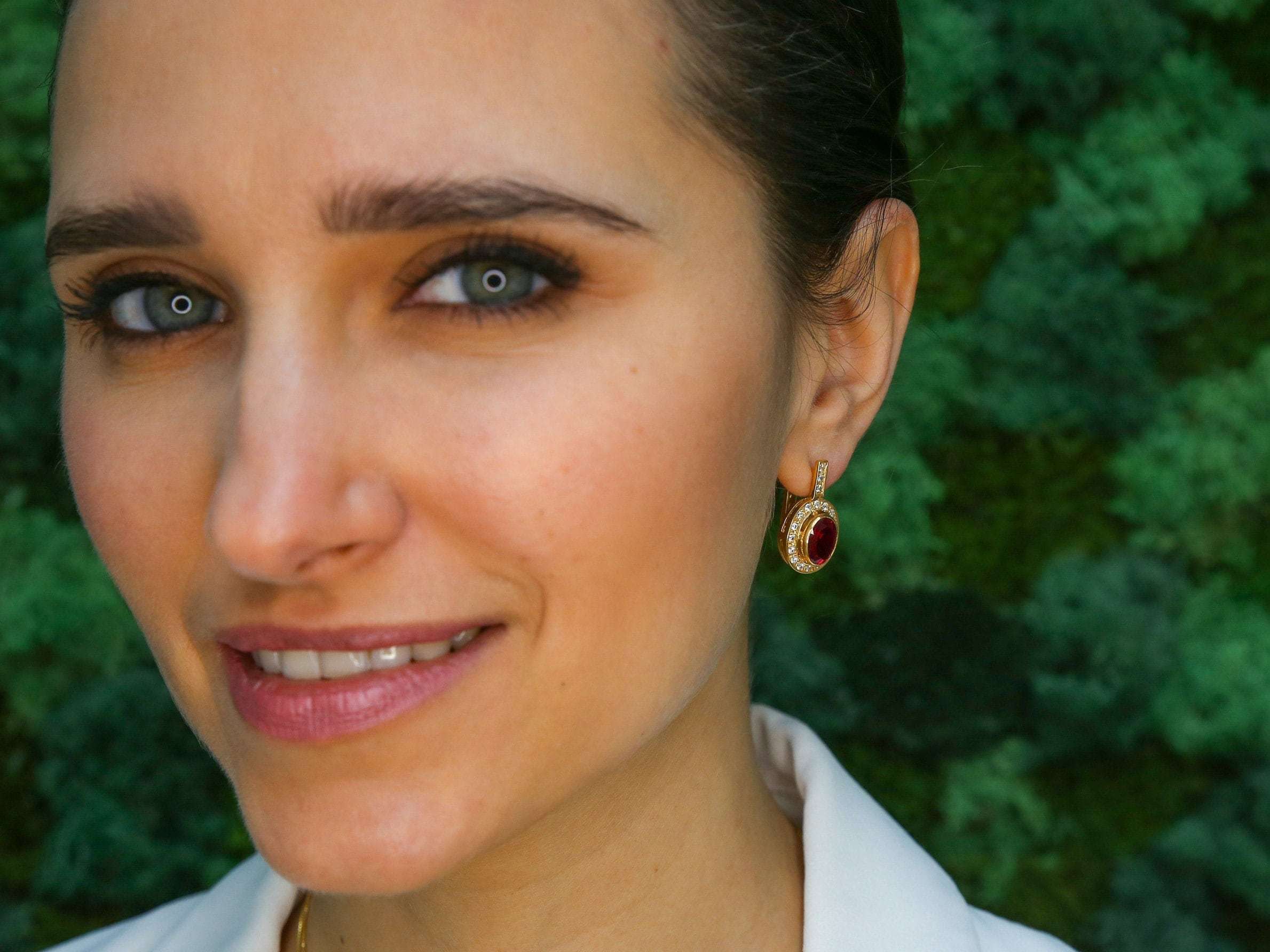 Elegant 18k Gold Vermeil Ruby Earrings featuring oval red rubies, perfect for July birthdays and special occasions.