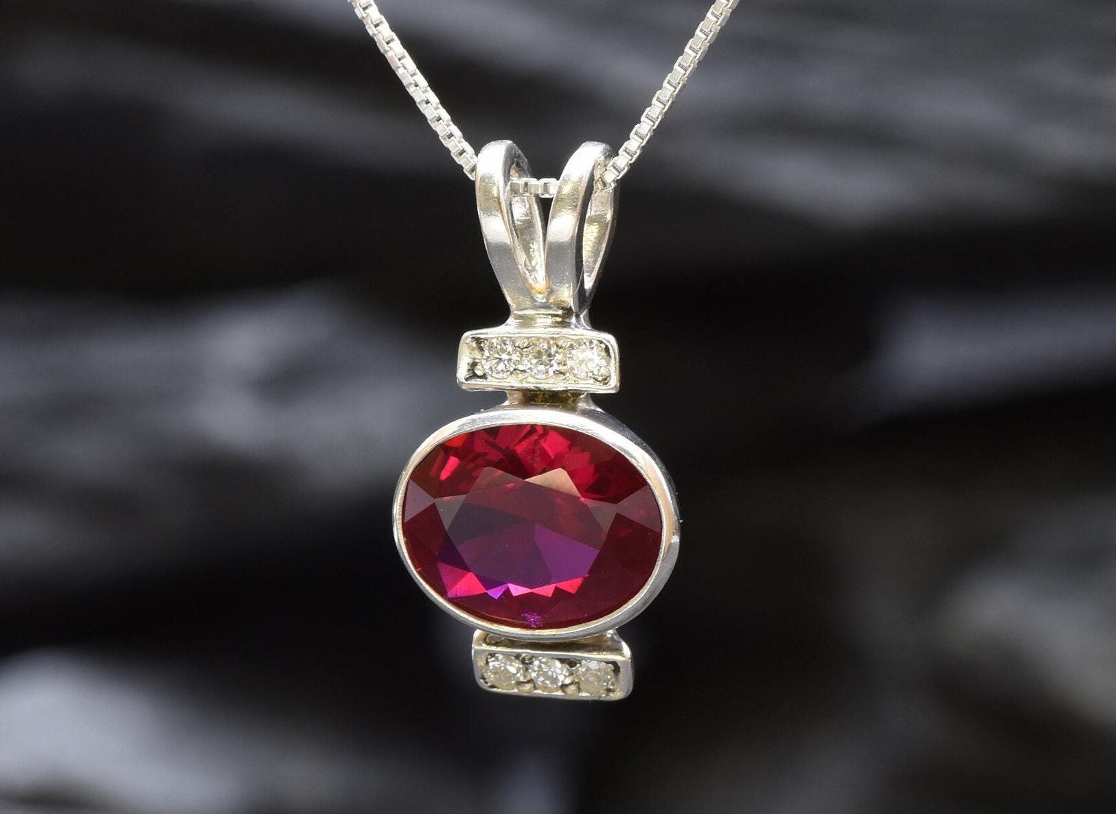 Sterling Silver Ruby Pendant featuring an Oval Created Red Ruby, perfect for July birthdays and special occasions.