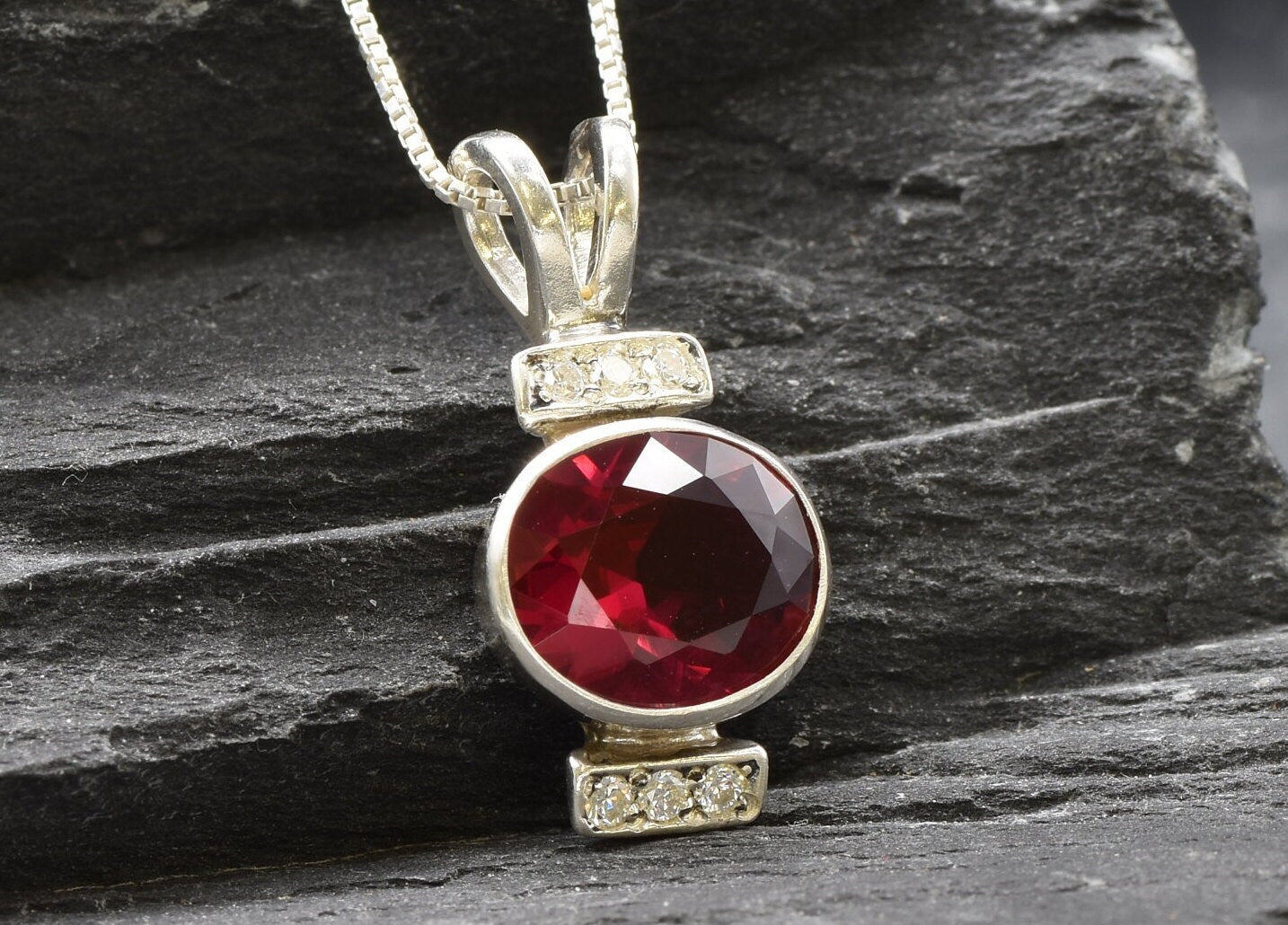Created Ruby Pendant made in 925 Sterling Silver with Oval Created Red Ruby in Bezel setting, July Birthstone gift idea, symbolizes nobility, purity, and passion, ideal for everyday wear and perfect for birthday gifting and special occasions.