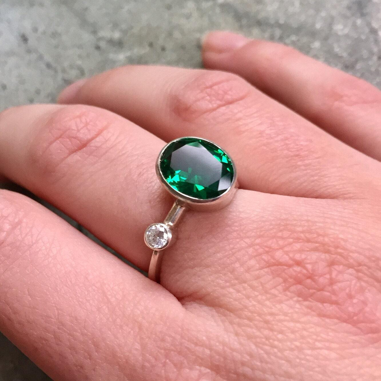 Elegant 925 Sterling Silver Emerald Ring featuring an Oval Created Green Emerald, perfect for May birthdays and special occasions.