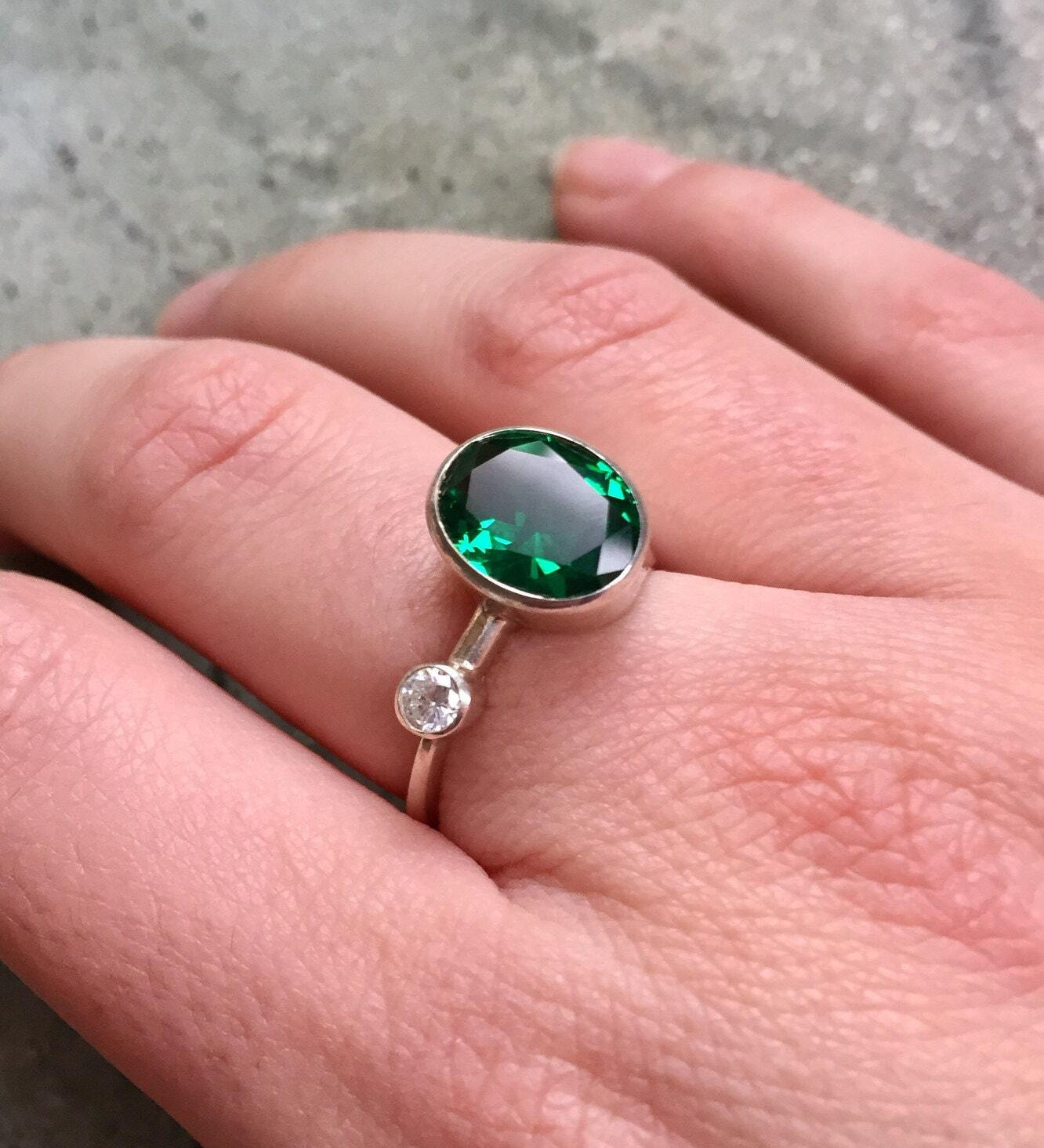 Elegant 925 Sterling Silver Emerald Ring featuring an Oval Created Green Emerald, perfect for May birthdays and special occasions.