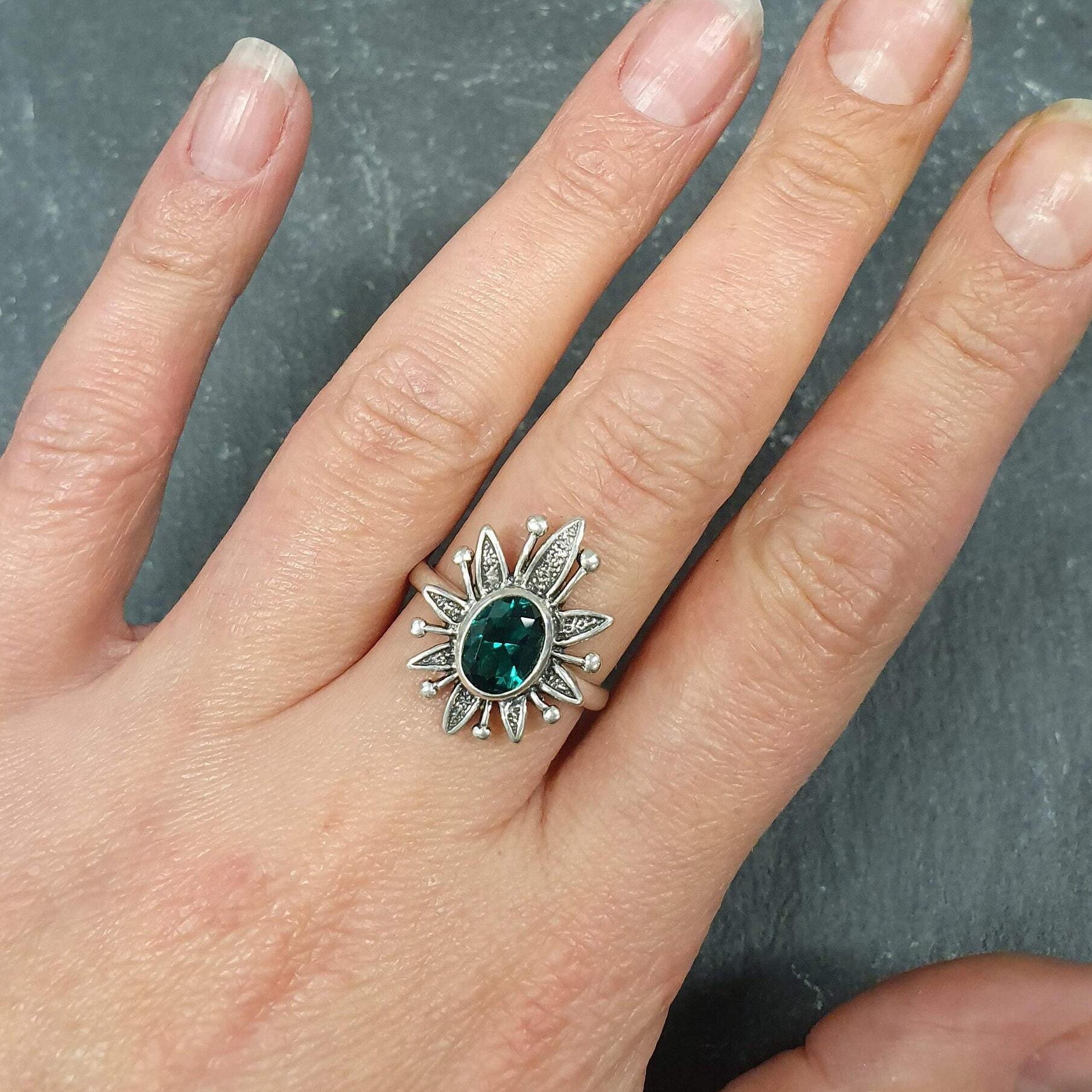 Elegant 925 Sterling Silver ring featuring an oval Created Green Emerald, perfect for May birthdays and special occasions.