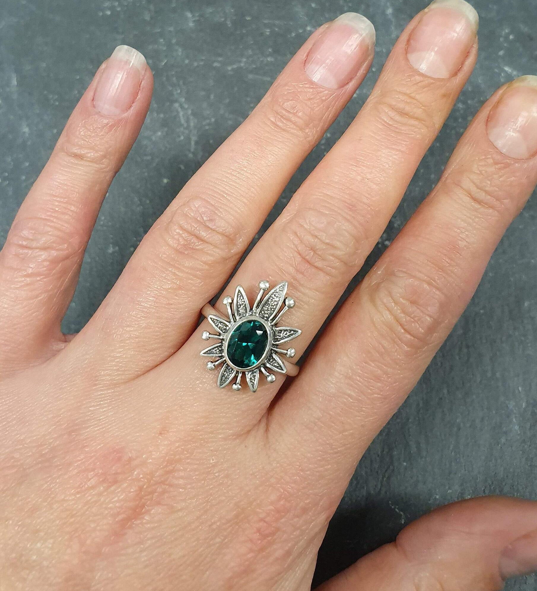 Elegant 925 Sterling Silver ring featuring an oval Created Green Emerald, perfect for May birthdays and special occasions.