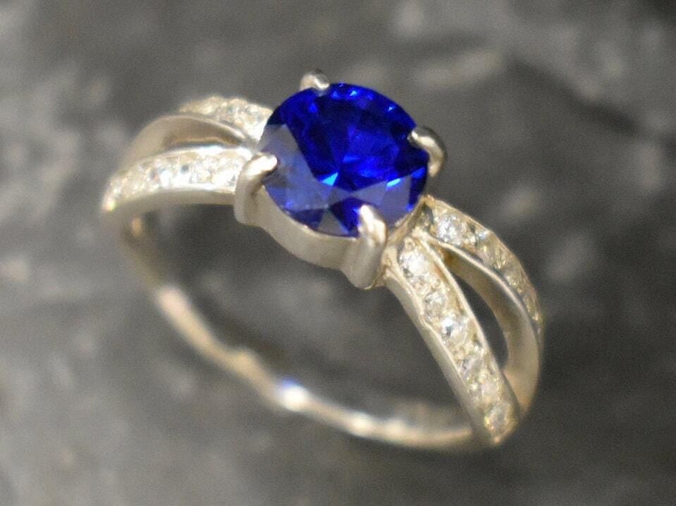 Created Sapphire Ring made in 925 Sterling Silver with Round Created Blue Sapphire in Solitaire with Accents setting, September Birthstone gift idea, symbolizes sincerity, truth, and faithfulness, ideal for everyday wear and perfect for birthday gifting and special occasions.