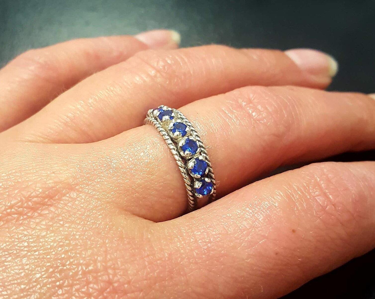 Channel-set created blue sapphire ring in 925 sterling silver, perfect for September birthdays and everyday elegance.