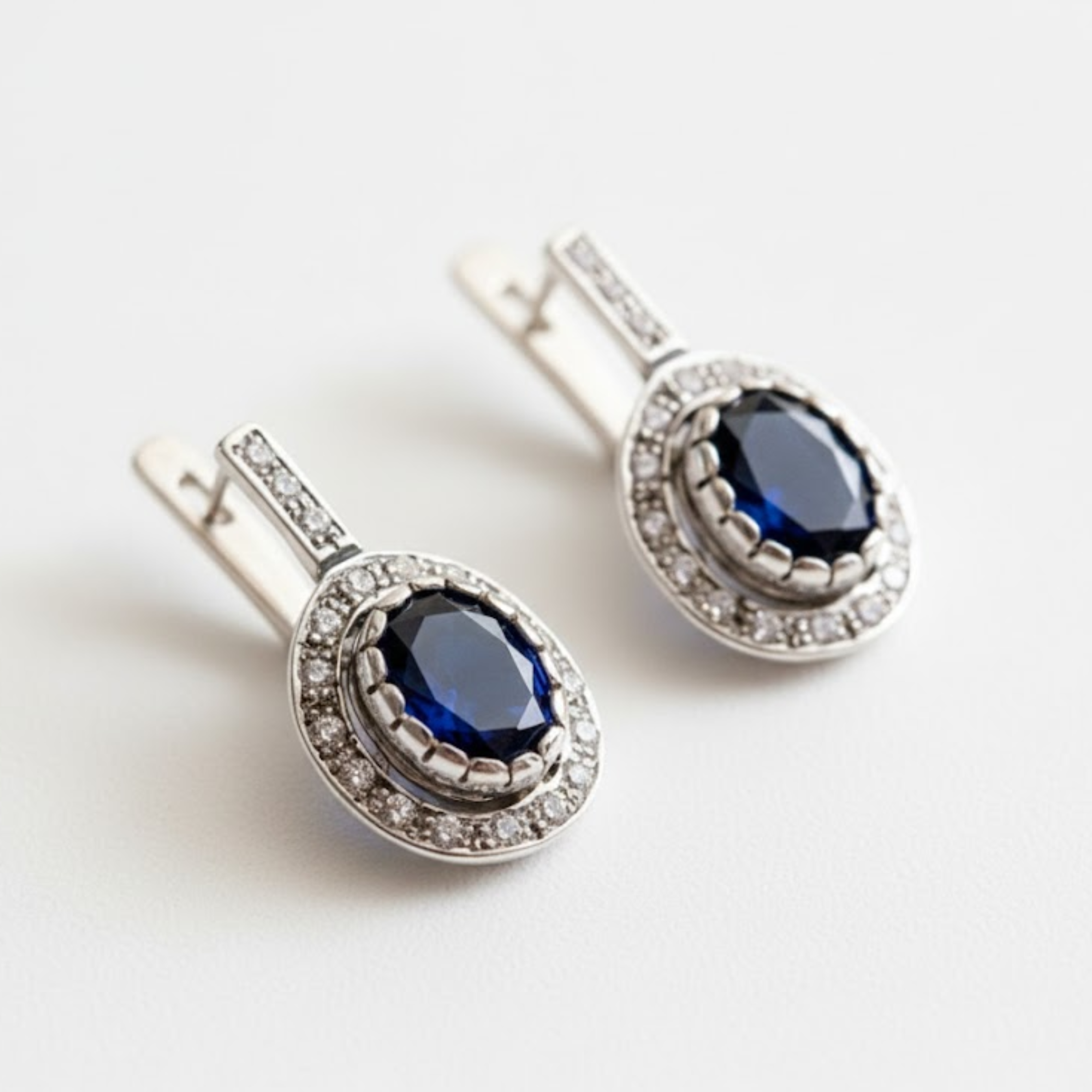 Created Sapphire Earrings made in 925 Sterling Silver with Oval Created Blue Sapphire in Prong setting, September Birthstone gift idea, symbolizes sincerity, truth, and faithfulness, ideal for everyday wear and perfect for birthday gifting and special occasions.