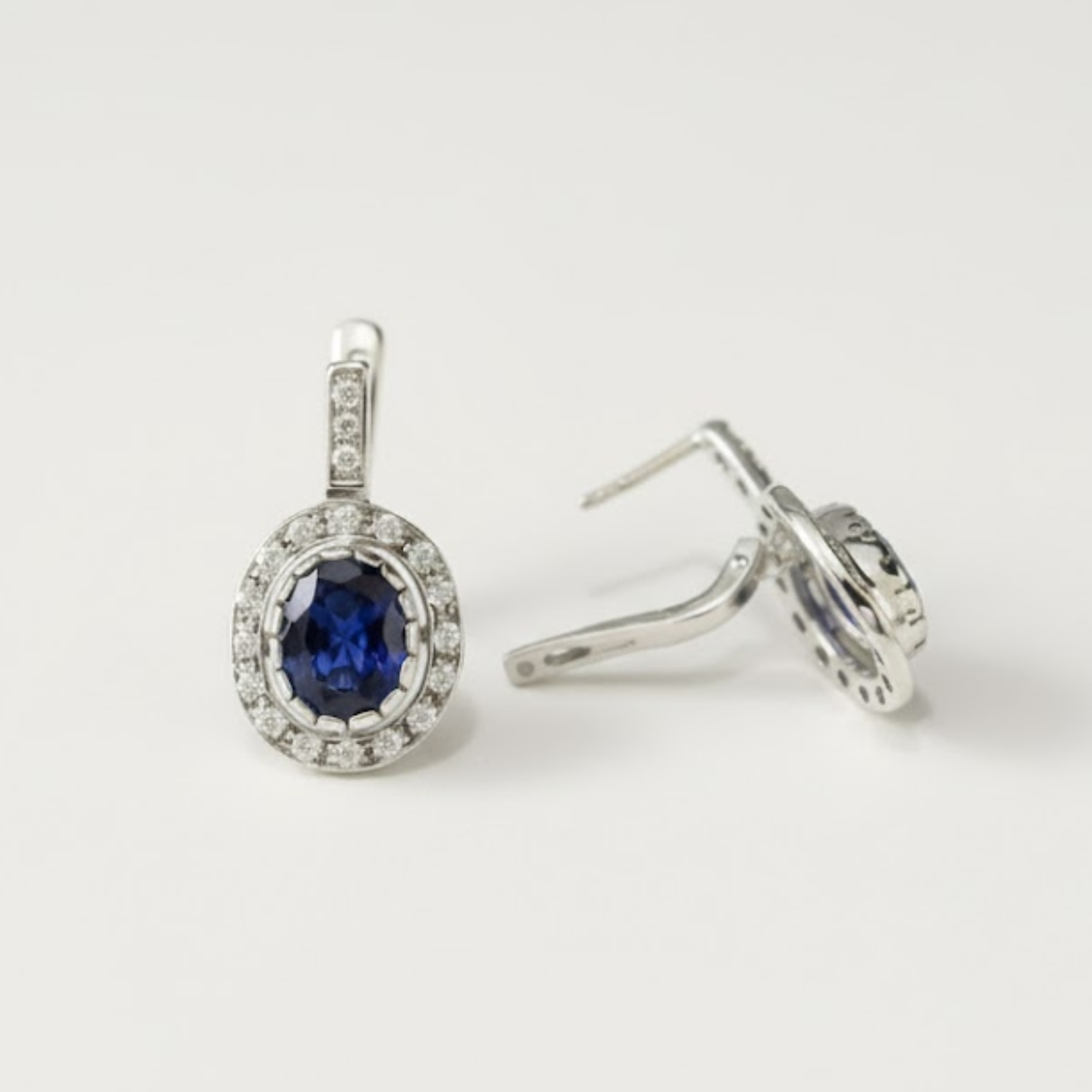 Elegant created sapphire earrings in sterling silver, embodying sincerity and perfect for daily wear and gifting.