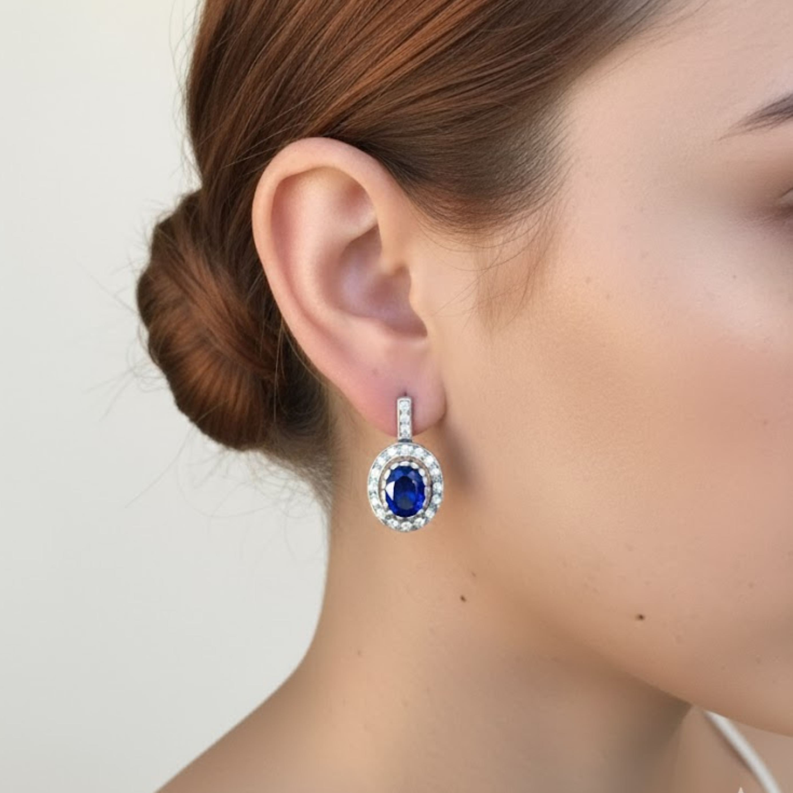 Sapphire Earrings in 925 Sterling Silver featuring a stunning oval blue sapphire, perfect for birthdays and special occasions.