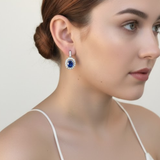 Beautifully crafted sterling silver earrings with oval created sapphire, an ideal gift for September birthdays and meaningful occasions.