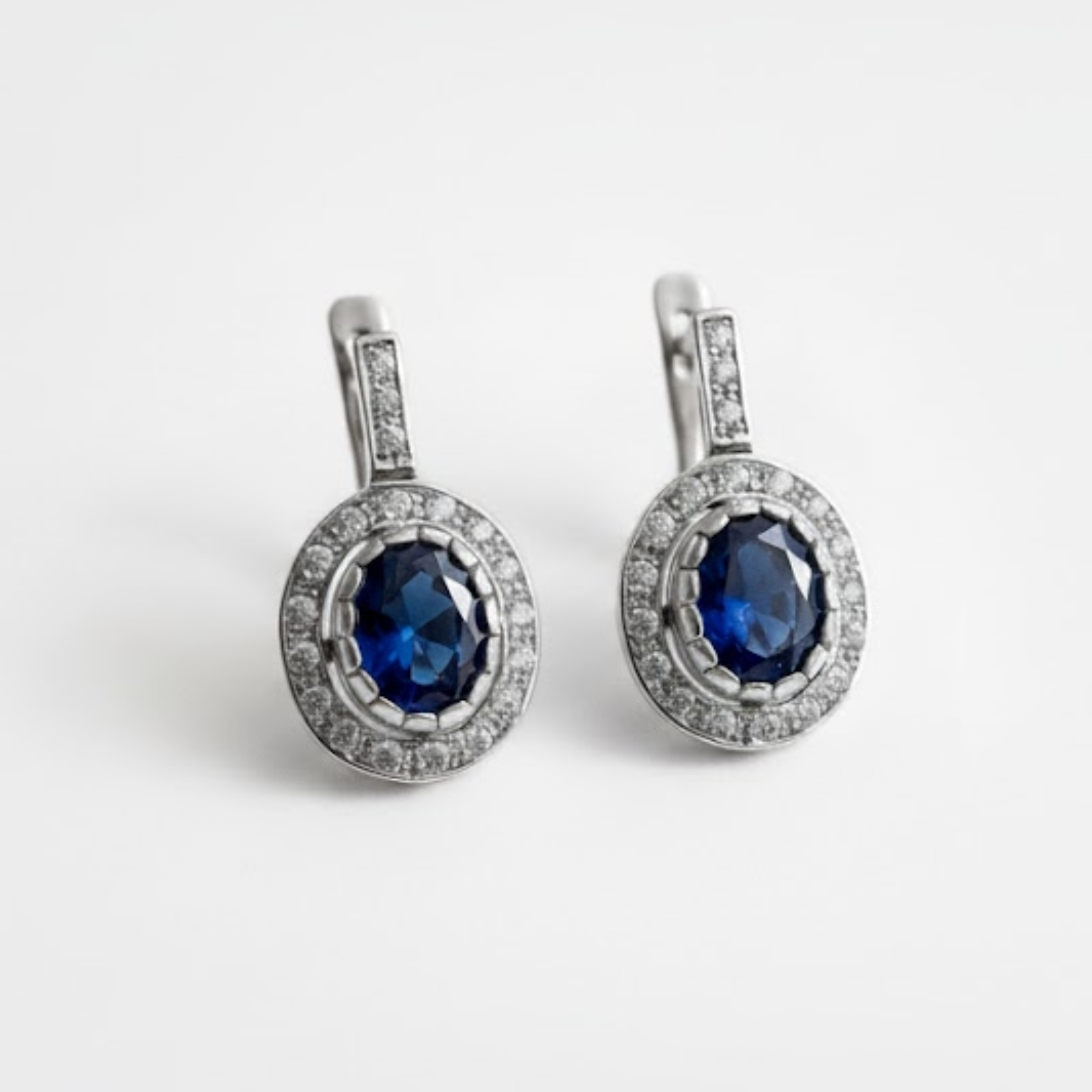 Created Sapphire Earrings made in White Gold Vermeil with Oval Created Blue Sapphire in Prong setting, September Birthstone gift idea, symbolizes sincerity, truth, and faithfulness, ideal for everyday wear and perfect for birthday gifting and special occasions.