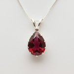 Created Ruby Pendant made in 925 Sterling Silver with Pear Created Red Ruby in Prong setting, July Birthstone gift idea, symbolizes nobility, purity, and passion, ideal for everyday wear and perfect for birthday gifting and special occasions.