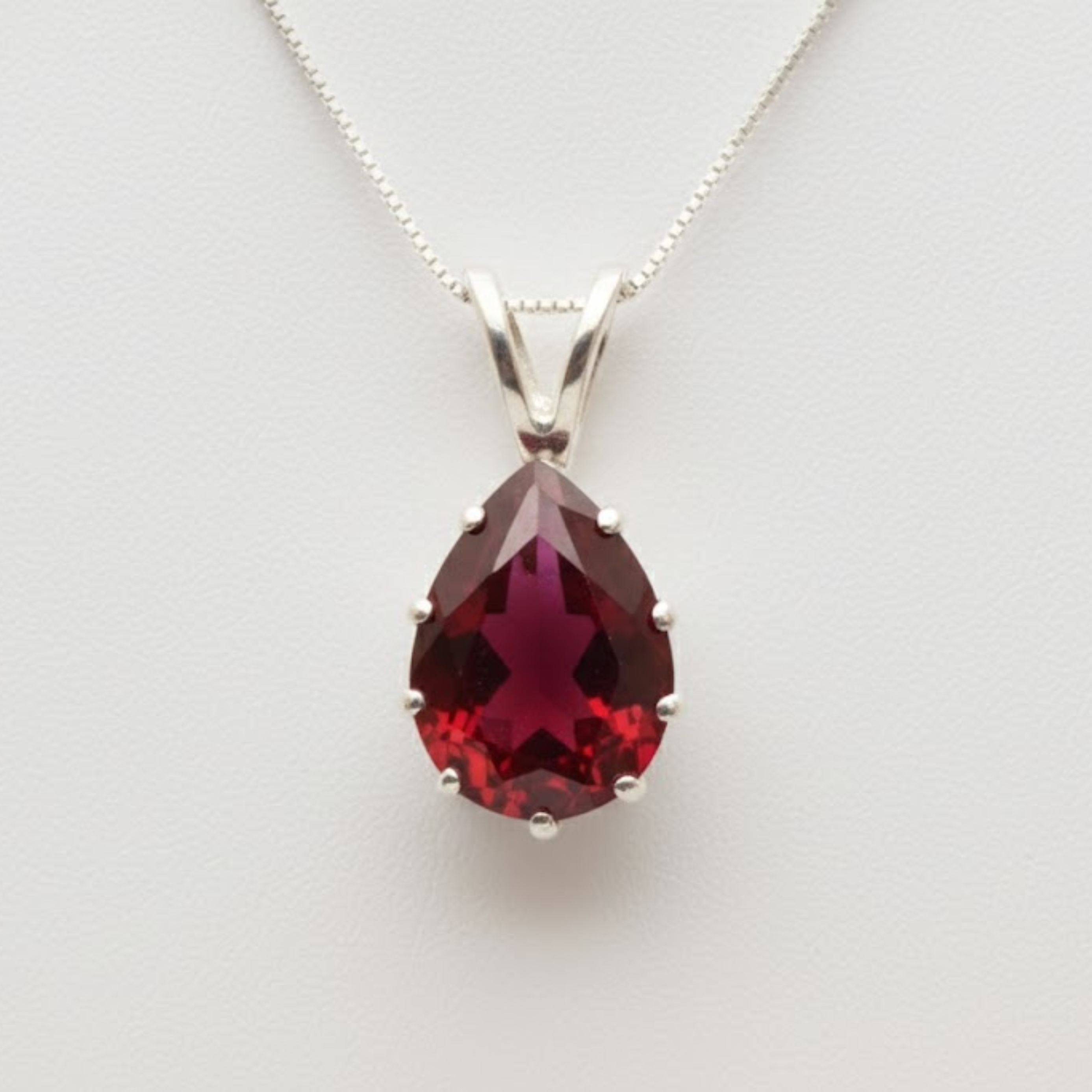 Created Ruby Pendant made in 925 Sterling Silver with Pear Created Red Ruby in Prong setting, July Birthstone gift idea, symbolizes nobility, purity, and passion, ideal for everyday wear and perfect for birthday gifting and special occasions.