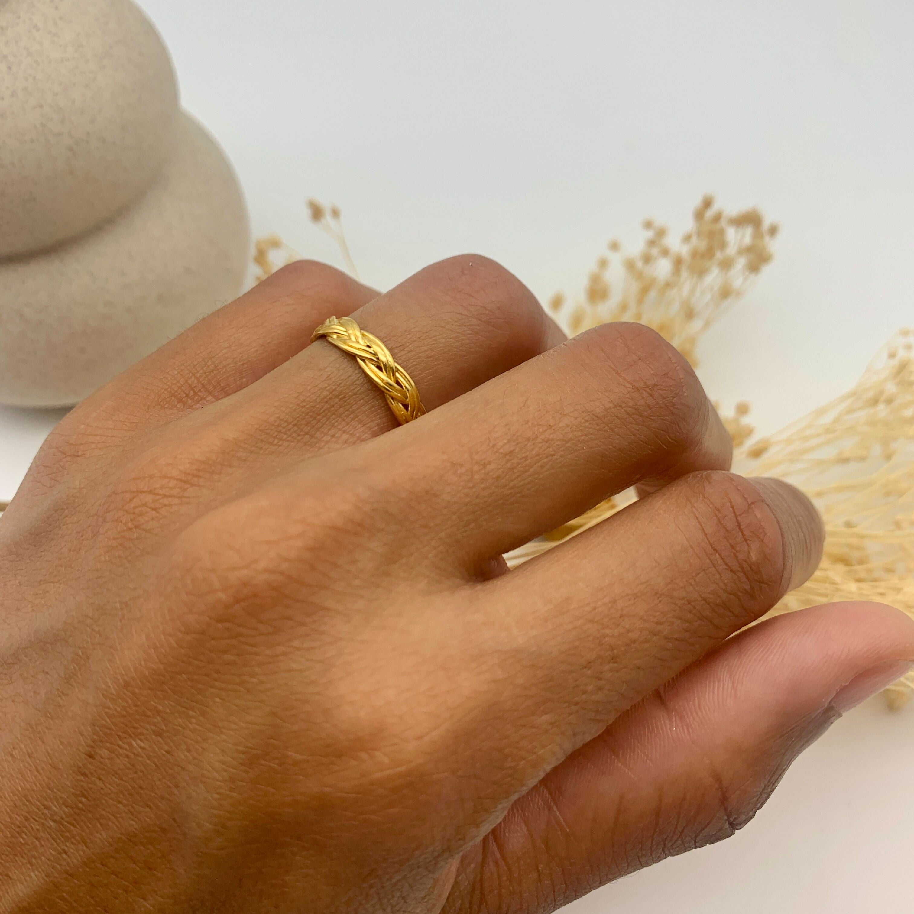 Gold Braided Band worn on Ring Finger
