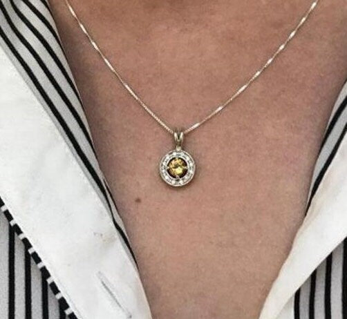 Sterling Silver Emerald Halo Pendant, May Birthstone, symbolizes harmony and healing, perfect for everyday wear and gifts.