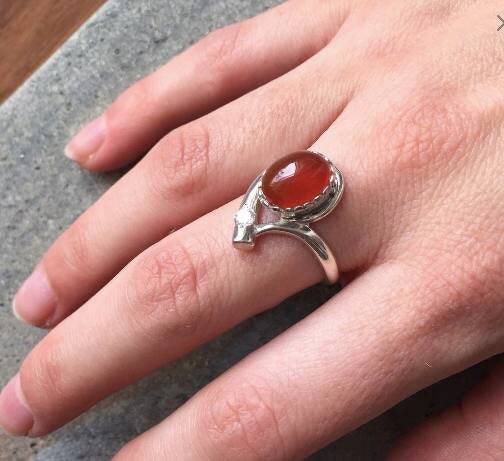 Elegant 925 Sterling Silver ring featuring an Oval Created Green Emerald, perfect for May birthdays and special occasions.