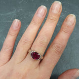 Chic 925 Sterling Silver Ruby Ring with Oval Created Ruby, a beautiful July birthstone gift symbolizing passion and purity.