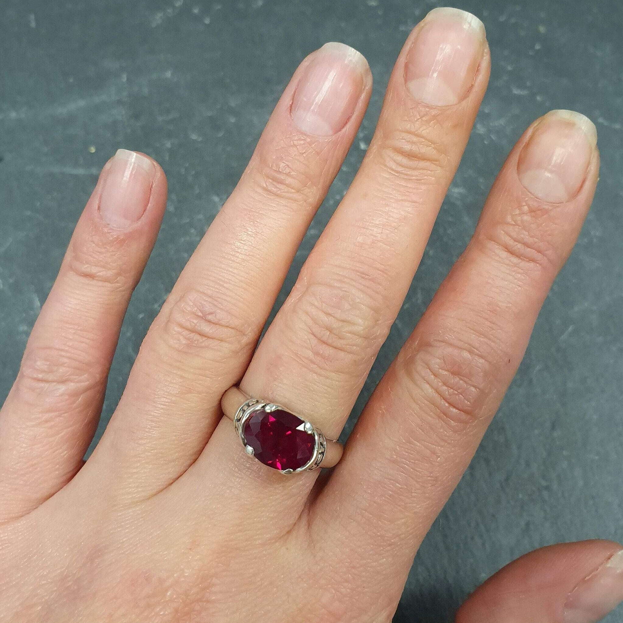 Chic 925 Sterling Silver Ruby Ring with Oval Created Ruby, a beautiful July birthstone gift symbolizing passion and purity.