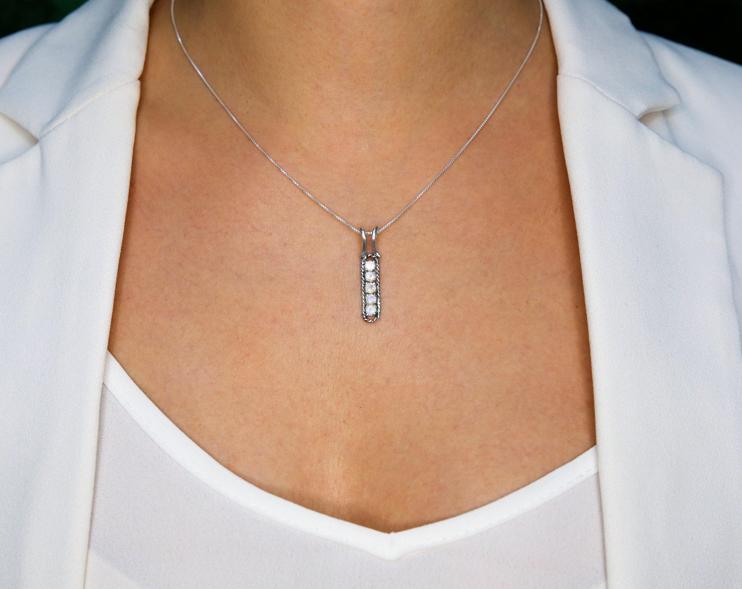 Elegant 925 Sterling Silver Ruby Pendant featuring a round natural red ruby, perfect for July birthdays and special occasions.