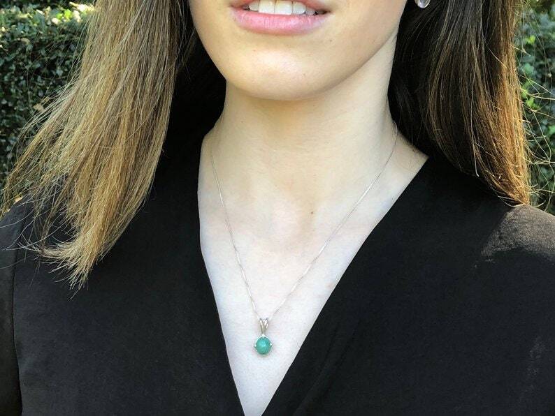 Elegant 925 Sterling Silver Emerald Pendant, featuring a vibrant green oval stone, perfect for May birthdays and special occasions.