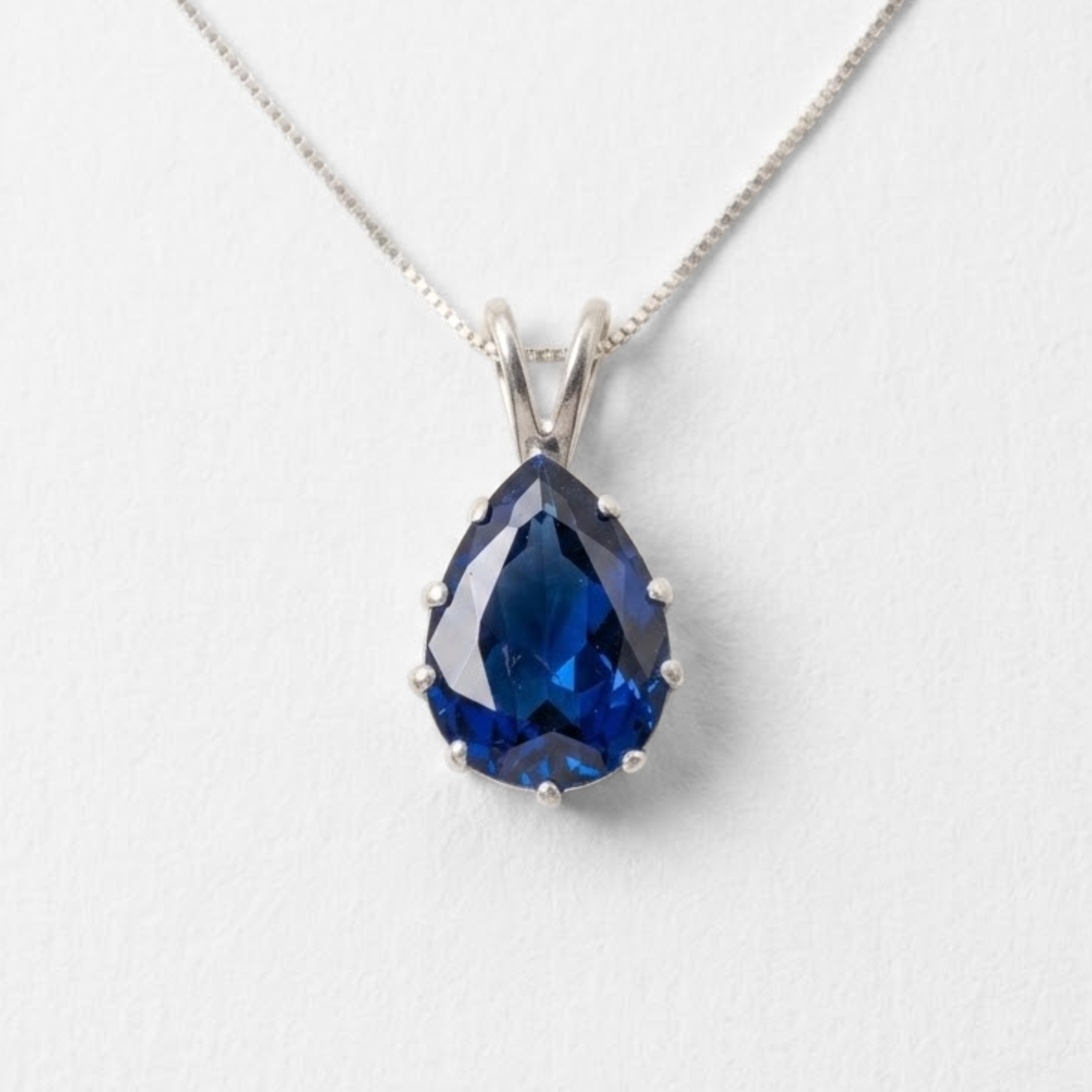 Created Sapphire Pendant made in 925 Sterling Silver with Pear Created Blue Sapphire in Prong setting, September Birthstone gift idea, symbolizes sincerity, truth, and faithfulness, ideal for everyday wear and perfect for birthday gifting and special occasions.