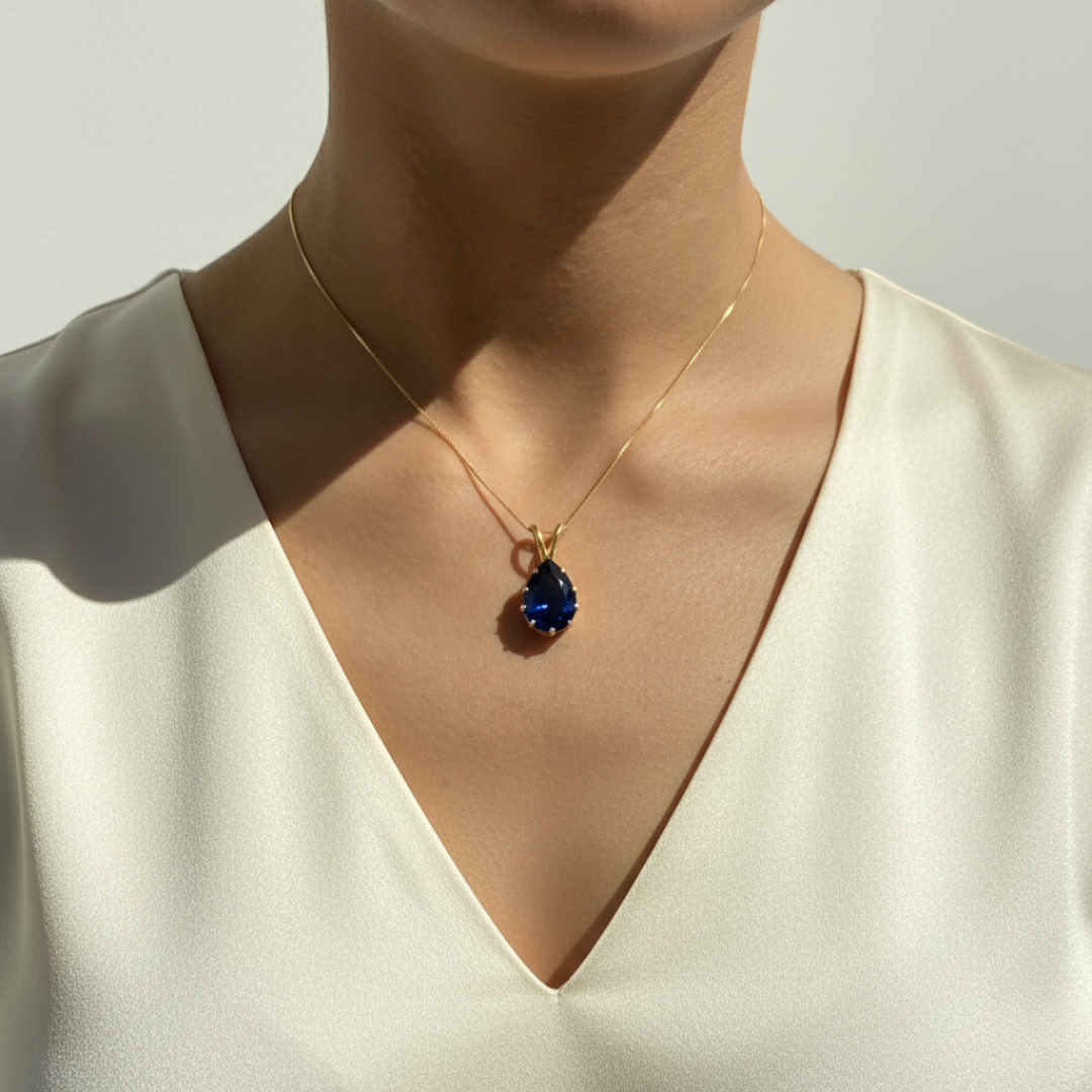 Elegant Created Sapphire Pendant in 18k Gold Vermeil, featuring a Pear Blue Sapphire, perfect for birthdays and special occasions.